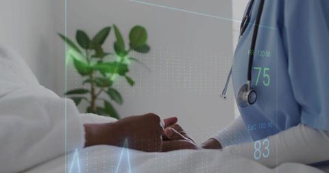 Nurse holding patient hand at bedside with vitals overlay, compassionate healthcare support