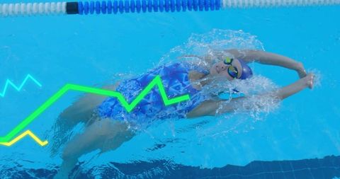 Backstroke swimmer gliding through lap pool with splash, goggles and swim cap