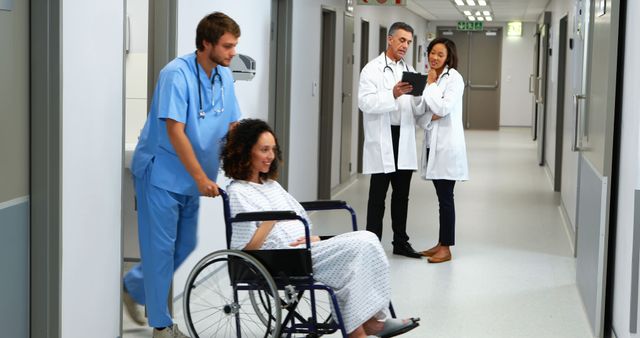 Healthcare Professionals Assisting Patient in Hospital Corridor - Download Free Stock Images Pikwizard.com