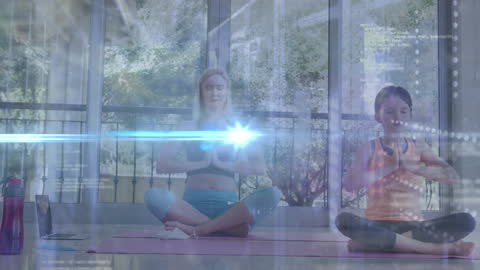 Caucasian Mother and Daughter Meditating with Digital Interface Overlay