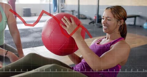 Women exercising with fitness ball and performance graph overlay