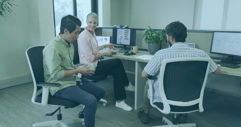 Coworkers sharing lunch in modern office setting