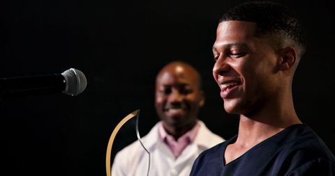 Young doctor receiving recognition at healthcare awards event