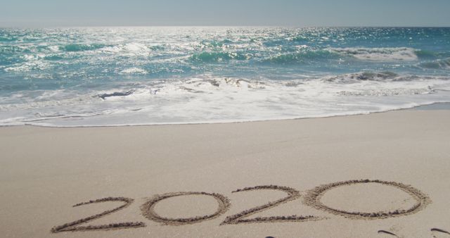 2020 Written in Sand on Ocean Beach with Waves - Download Free Stock Images Pikwizard.com