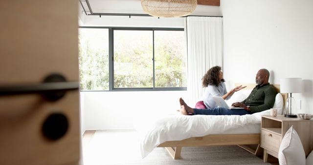 Couple Talking on Bed in Bright Bedroom - Download Free Stock Images Pikwizard.com