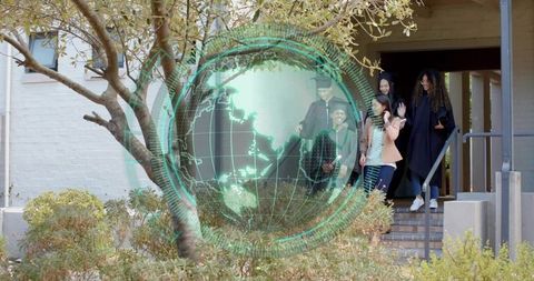 Multicultural family celebrating graduates on brick steps with holographic globe overlay