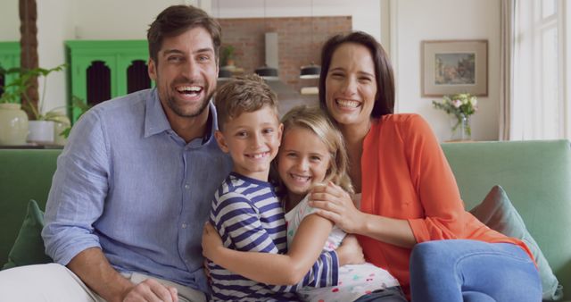 Happy Family Smiling While Relaxing on Couch in Living Room - Download Free Stock Images Pikwizard.com