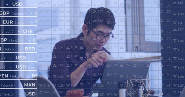 Focused Asian Businessman Analyzing Financial Data with Laptop and Forex Chart Overlay - Download Free Stock Images Pikwizard.com