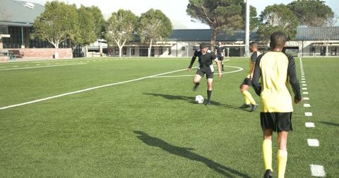 Soccer Practice on Sunny Day with Coaches and Athletes in Action