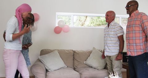 Elderly Friends Celebrating Cancer Survival with Cake and Joy