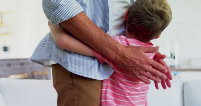 Father Embracing Child in Warm Hug at Home - Download Free Stock Images Pikwizard.com