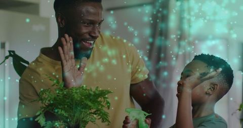 Father and Son Bonding While Watering Plants with Magical Light Effects