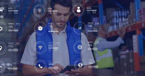 Warehouse worker scanning tablet with HUD inventory analytics for logistics automation
