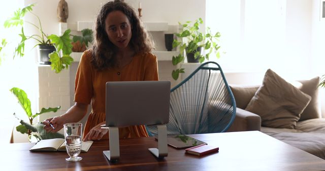 Woman Working on Laptop at Home Office with Houseplants - Download Free Stock Images Pikwizard.com