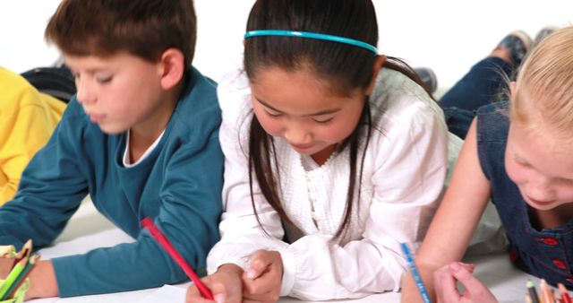 Children Engaged in Coloring with Crayons on Floor - Download Free Stock Images Pikwizard.com