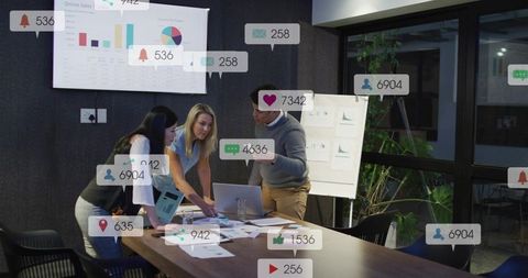Marketing Team Collaborating Over Analytics Dashboard and Social Engagement Insights