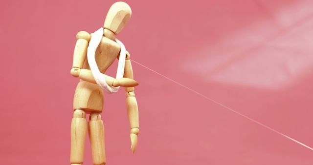 Wooden Mannequin with Arm Sling on Pink Background - Download Free Stock Images Pikwizard.com