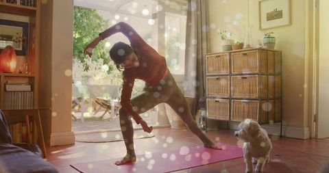 Woman Exercising at Home with Curious Dog in Cozy Living Room