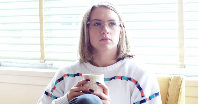 Pensive Woman Holding Coffee Cup Near Window - Download Free Stock Images Pikwizard.com