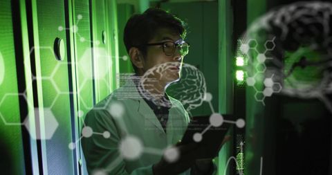 Asian Scientist Using Tablet in Data Center with Digital Brain Interface - Download Free Stock Images Pikwizard.com