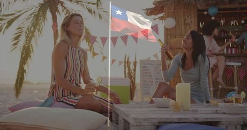 Friends Enjoying Tropical Beach Party at Sunset