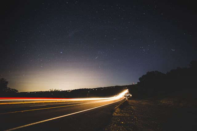 Long Exposure of Cars on Highway at Night with Clear Starry Sky - Download Free Stock Photos Pikwizard.com