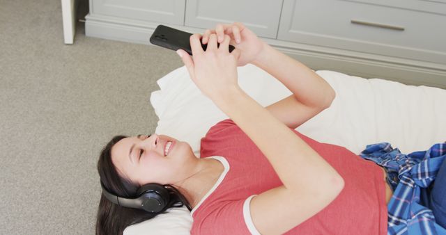 Teenage Girl Listening to Music and Using Smartphone at Home - Download Free Stock Images Pikwizard.com