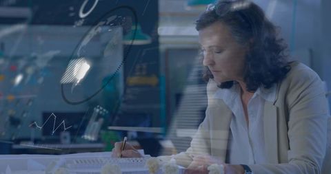 Midcareer woman designing prototype, reviewing architectural scale model with data overlays