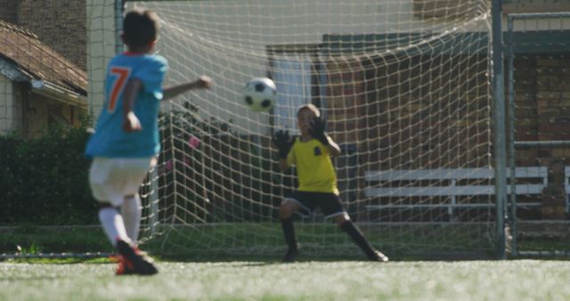 Children Playing Soccer with Young Goalkeeper Blocking Shot - Download Free Stock Images Pikwizard.com