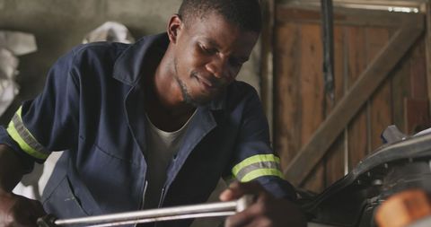African Car Mechanic in Workshop Repairing Vehicle - Download Free Stock Images Pikwizard.com