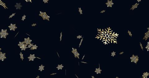 Golden snowflakes on dark background for elegant holiday theme