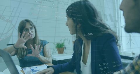 Financial Analysis Team with Data Graphics Overlay in Modern Office