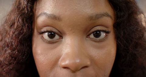 Confident African American Woman Gazing in Close-up Portrait