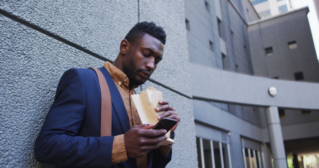 Businessman Taking Break Eating Sandwich Checking Smartphone - Download Free Stock Images Pikwizard.com