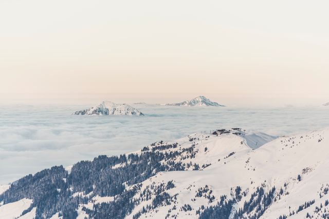 Aerial View of Snow-Capped Mountains and Calm Morning Fog - Download Free Stock Photos Pikwizard.com
