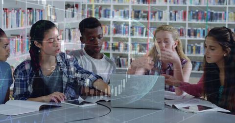 diverse students collaborating over laptop on global project in library - Download Free Stock Images Pikwizard.com