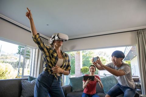 Friends Enjoying VR Technology in Modern Living Room
