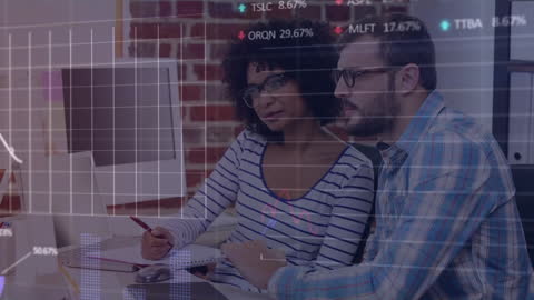 Focused Business Team Analyzing Financial Data on Computer Screen