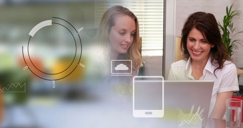 Professional Women Collaborating with Digital Technology and Data Graphics