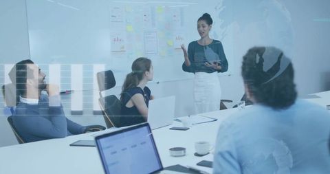 Businesswoman Leading Corporate Meeting in Modern Conference Room