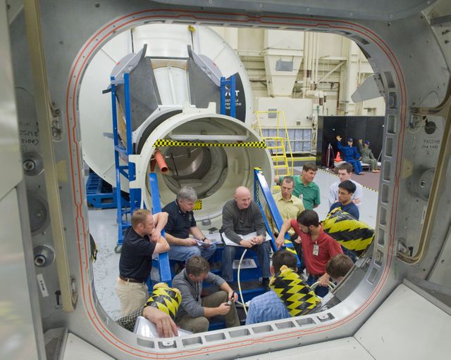 JSC2010-E-194300 (4 Dec. 2010) --- STS-134 crew members participate in an ingress/egress training session in the Space Vehicle Mock-up Facility at NASA's Johnson Space Center. Pictured are NASA astronauts Mark Kelly, commander; Gregory H. Johnson, pilot; Andrew Feustel, Michael Fincke and European Space Agency astronaut Roberto Vittori, all mission specialists. Not pictured is NASA astronaut Greg Chamitoff, mission specialist. Photo credit: NASA or National Aeronautics and Space Administration