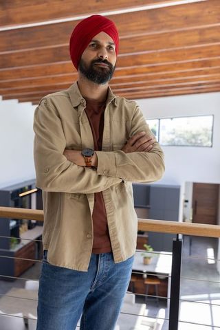 Confident Professional Checking Time in Modern Loft Office