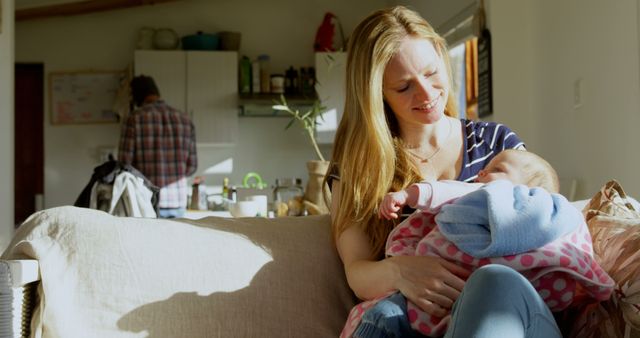 Smiling Mother Holding Her Baby at Home - Download Free Stock Images Pikwizard.com