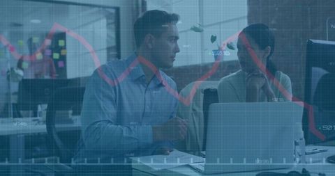 Business Professionals Collaborating With Laptop and Analytics Data