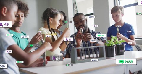 Teacher and diverse schoolchildren engaged in interactive lesson on technology