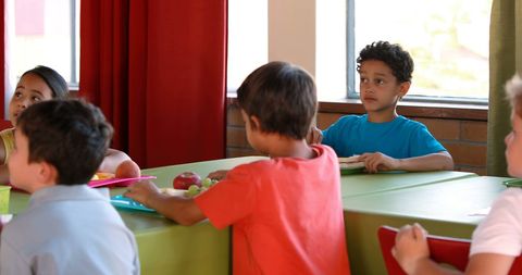Children enjoying lunch in school cafeteria