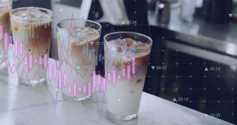 Iced coffee glasses projecting stock market charts overlay for finance cafe lifestyle