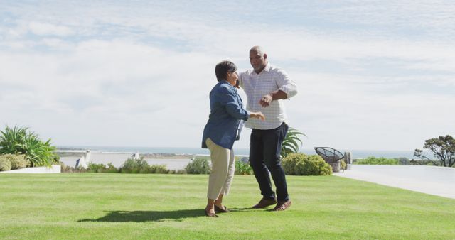 Joyful Senior Couple Dancing Outdoors on Sunny Day - Download Free Stock Images Pikwizard.com