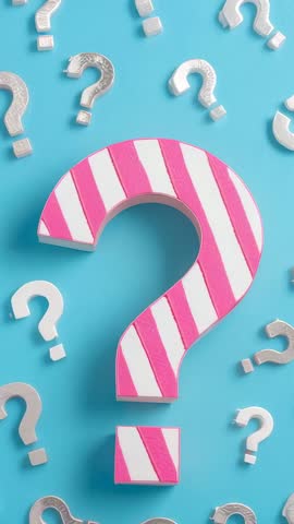 Revealing striped pink question mark floating on blue backdrop for vertical video