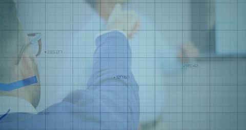 Business Professional Analyzing Data on Transparent Board